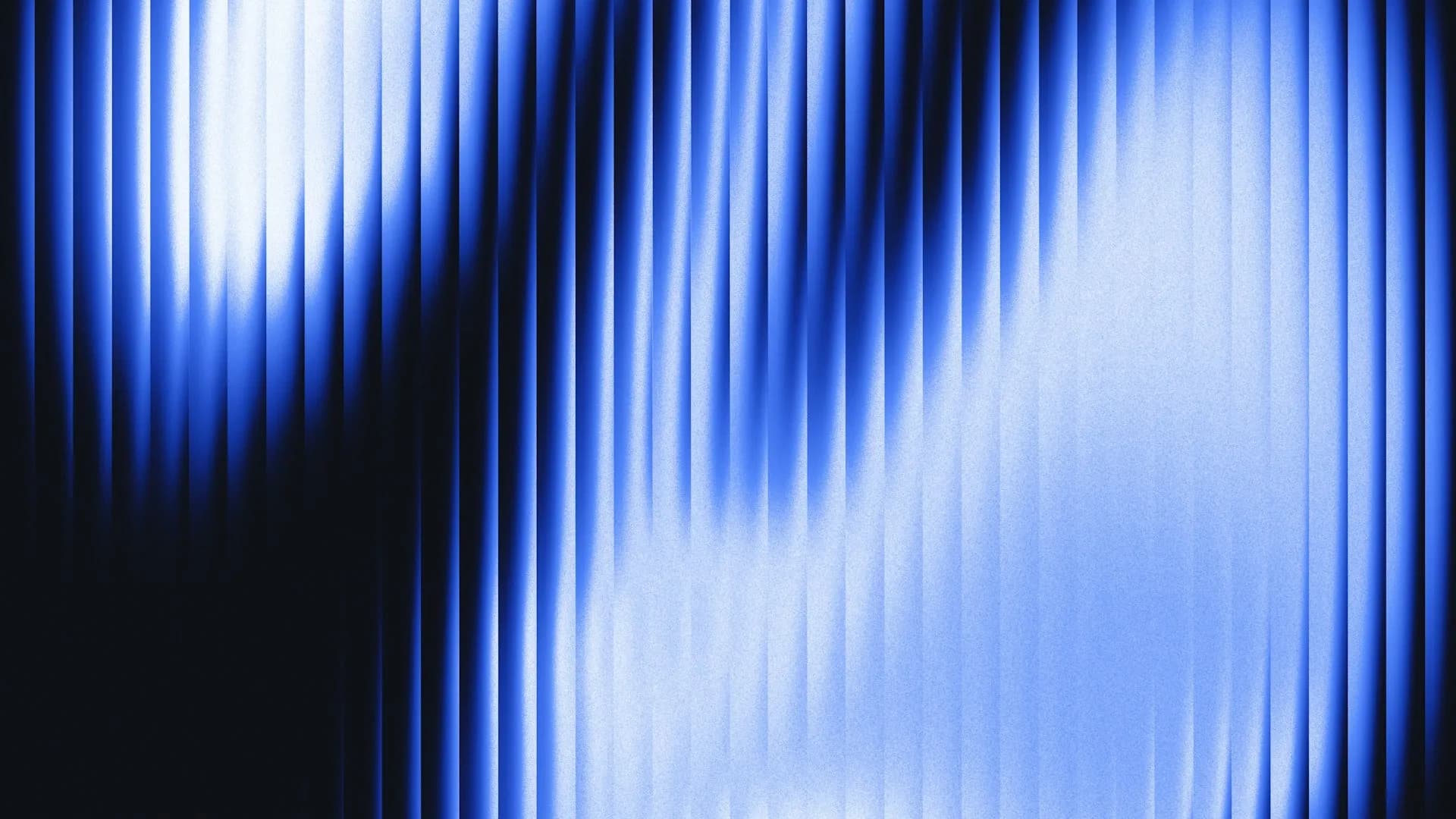 Abstract blue light streaks through vertical ribbed glass